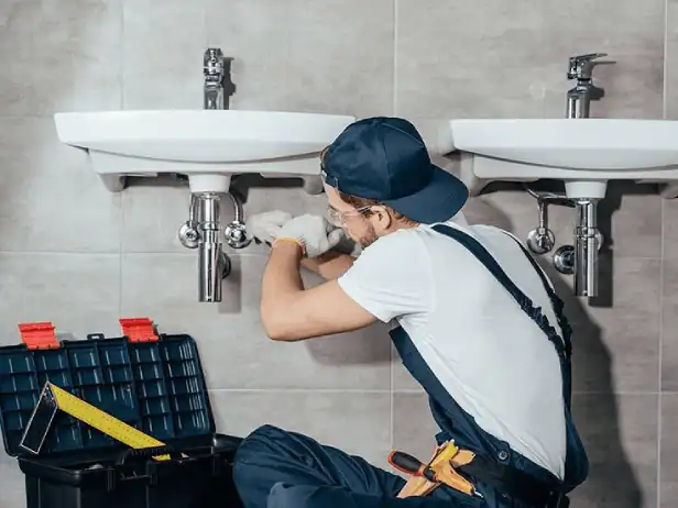 Licensed-Plumber-Repairing-Bathroom-Sink-Drain-Pipe-With-Tools